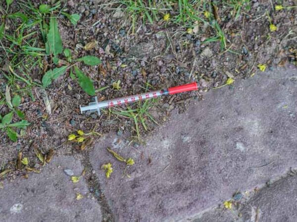 Used needle on the ground during hoarder cleaning